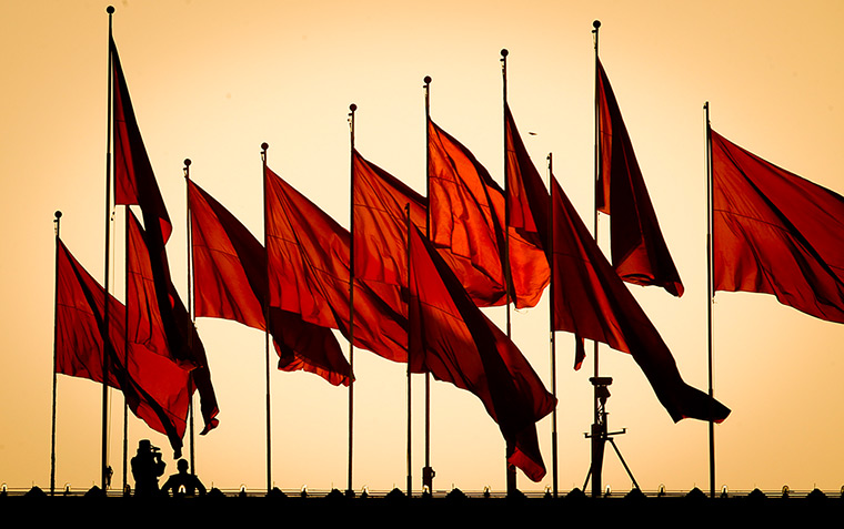 24 hours: Beijing, China: A paramilitary police man monitors Tiananmen Square 