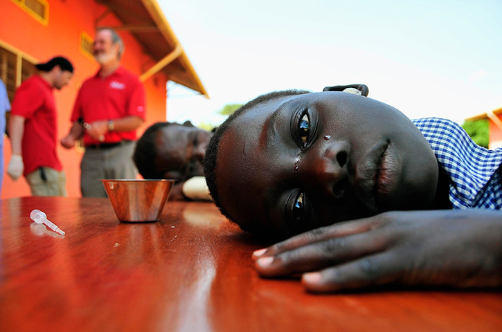 24 hours: Gulu, Uganda: A girl with hearing difficulties cries 