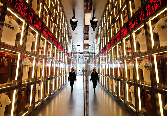 24 hours: Tokyo, Japan: A staff member in a new flagship Uniqlo store 