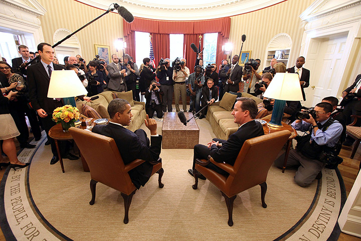 Cameron in US: Barack Obama and David Cameron talk during their Oval Office