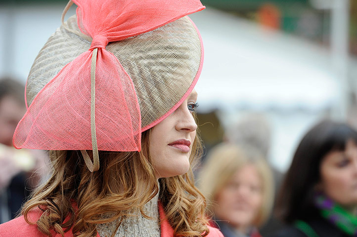 Cheltenham day 2: Woman wearing hat on Ladies Day at Cheltenham festival