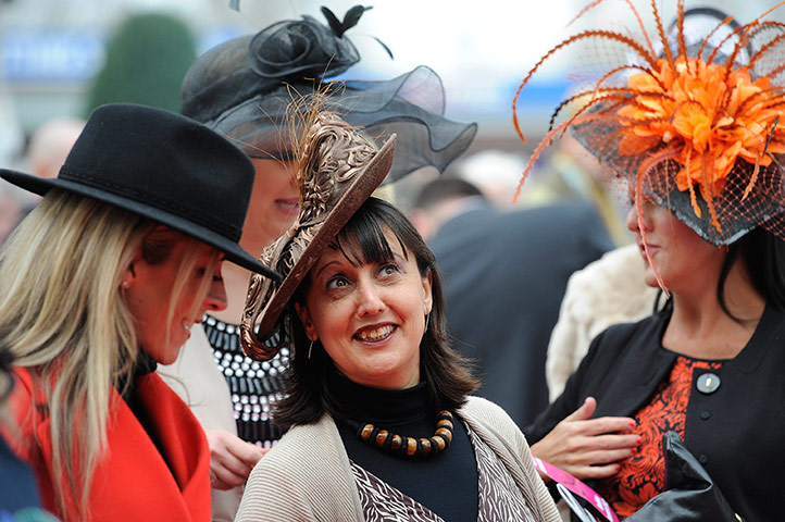 Cheltenham day 2: Women wearing hats on Ladies day at Cheltenham
