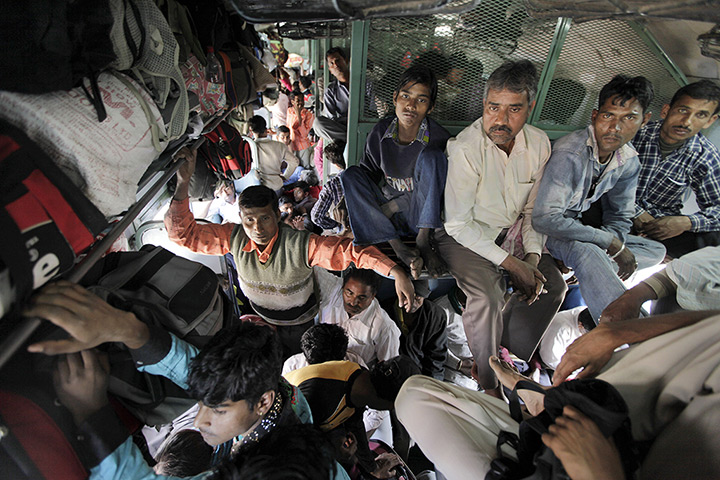 24 hours: New Delhi, India: Passengers onboard a train