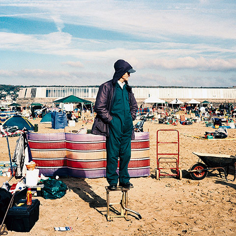 In Pictures: A man on a stool on Weston beach