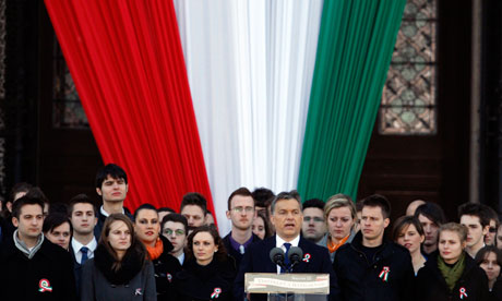 Viktor Orbán delivers a speech in front of the Hungarian parliament building in Budapest