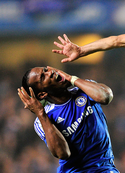 Best of the week: Chelsea's Didier Drogba is caught by Napoli's Hugo Campagnaro 