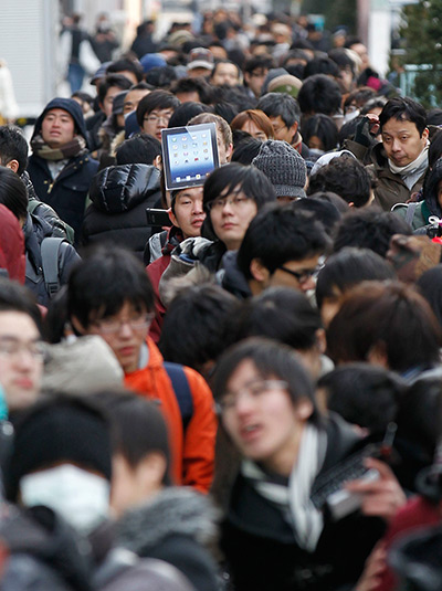 New iPad goes on sale: Tokyo, Japan: People queue in front of the Apple Store