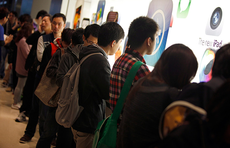 New iPad goes on sale: Hong Kong, China: Customers queue up to purchase the latest Apple iPad