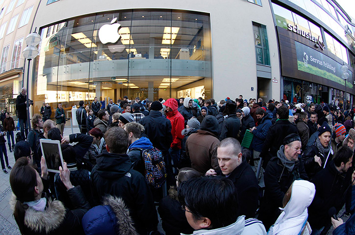 New iPad goes on sale: Munich, Germany: People await sales of the new iPad