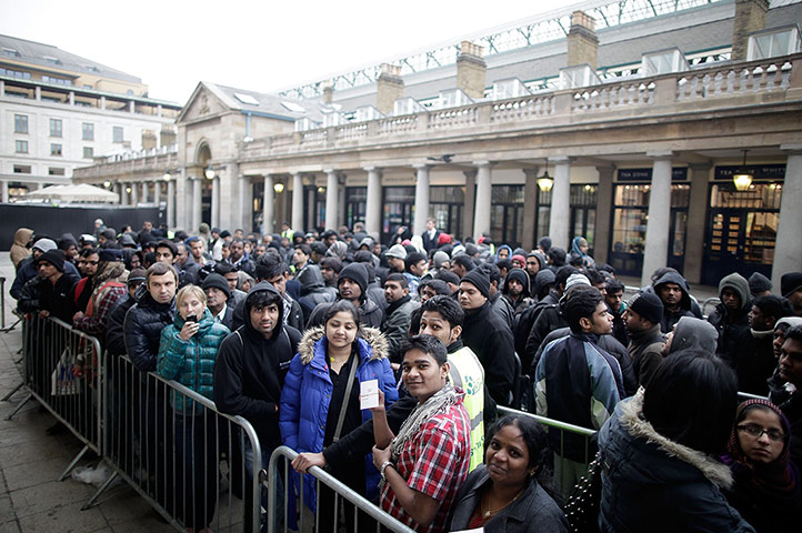 The new iPad: London, England: People queue outside the Apple Store in Covent Garden