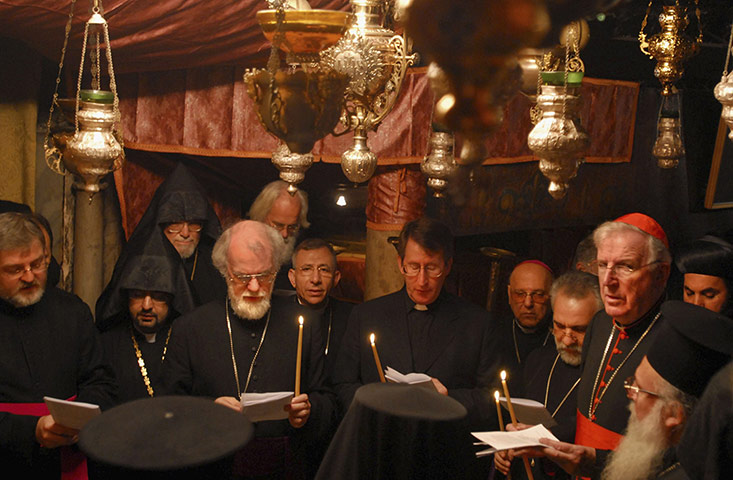 Dr Rowan Williams: The archbishop of Canterbury prays in the Church of the Nativity, Bethlehem