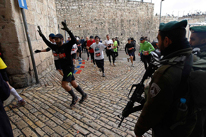 Jerusalem Marathon: Israeli border police guard as runners take part Jerusalem Marathon