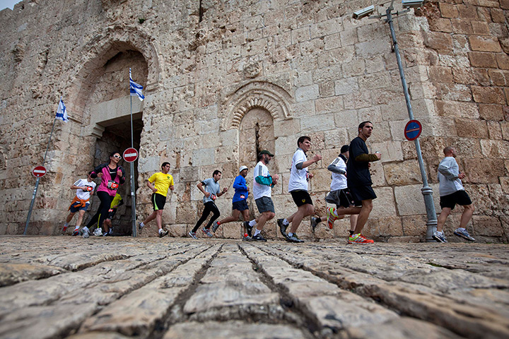 Jerusalem Marathon: Runners are seen next the Jerusalem's old city Zion Gate