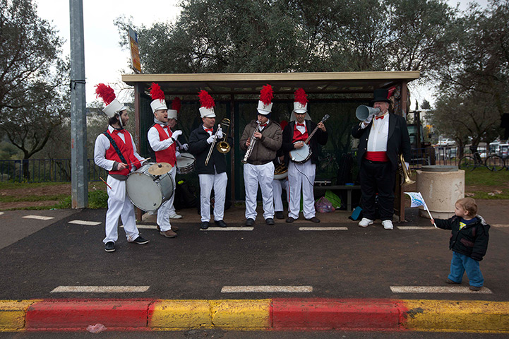 Jerusalem Marathon: A band stands in a bus station during the second annual marathon