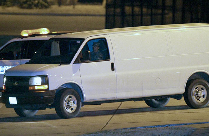 Robert Bales gallery: A van believed to be carrying Robert Bales leaves Kansas City airport