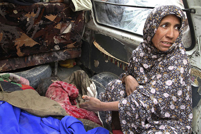 Robert Bales gallery: An Afghan woman with the body of her grandchild