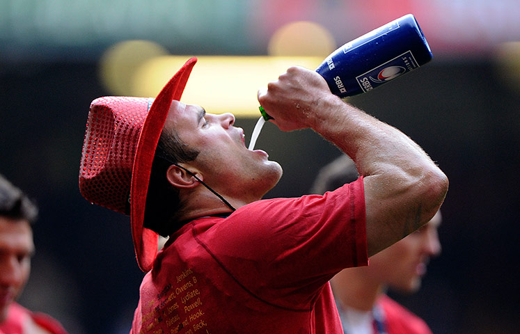 Wales v France: Welsh centre Jamie Roberts drinks champagne on the lap of honour