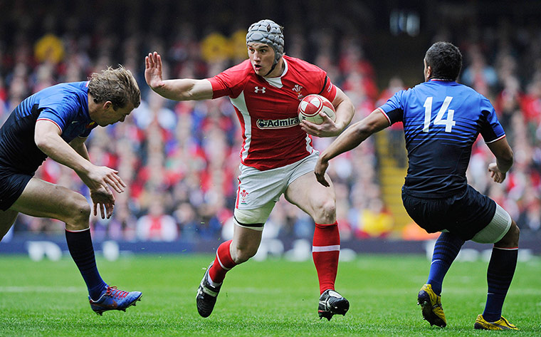 Wales v France: Jonathan Davies prepares to hand off Aurelien Rougerie