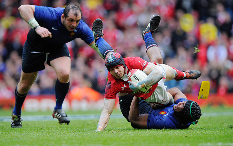 Wales v France: Leigh Halfpenny tackled by Thierry Dusautoir