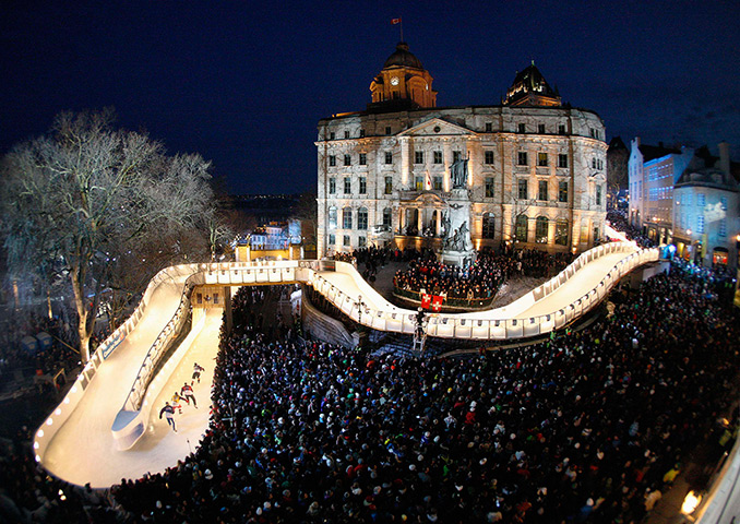 24 hours in pictures: Competitors skate during the Red Bull Crashed Ice competition