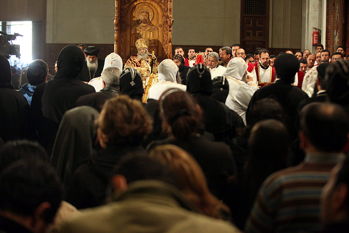 Pope Shenouda III: Egyptian Christians gather inside the Abassiya Cathedral
