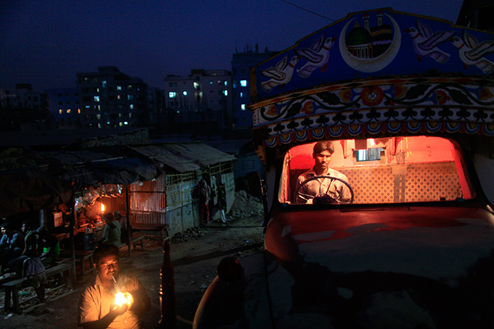 24 hours in pictures: Dhaka, Bangladesh: Drivers gather in front of a truck