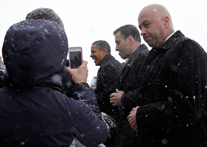 24 hours in pictures: Manchester, US: Barack Obama greets people