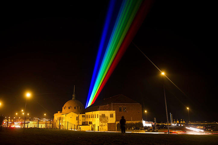 24 hours in pictures: Whitley Bay, UK: Yvette Mattern shows his laser rainbow projection