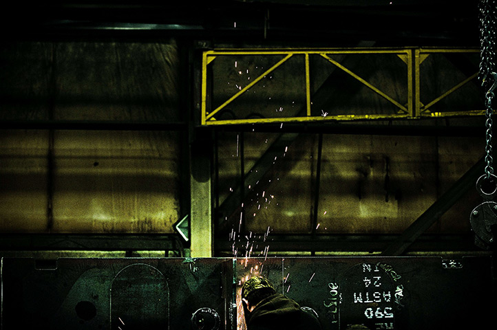 24 hours in pictures: North Lima, US: An employee at Specialty Fab