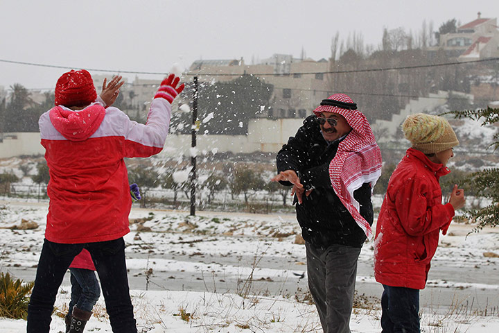 Snow: People play in the snow after a heavy snowstorm