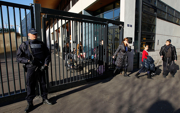 Toulouse shooting: A French police officer stands guard at a Jewish school in Paris 