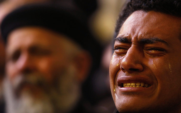 Pope Shenouda Funeral: Egyptian Christian reacts during the funeral of Pope Shenouda