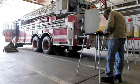 Illinois voters go to the polls at a fire station 