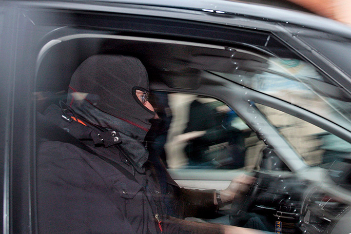 Toulouse raid: A masked French special intervention police (RAID) officer arrives 