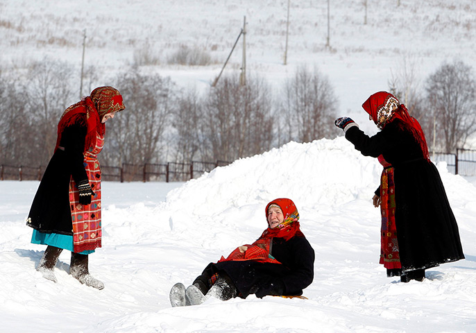 Russia's Eurovision: Members of the singing group Buranovskiye Babushki play in the snow 