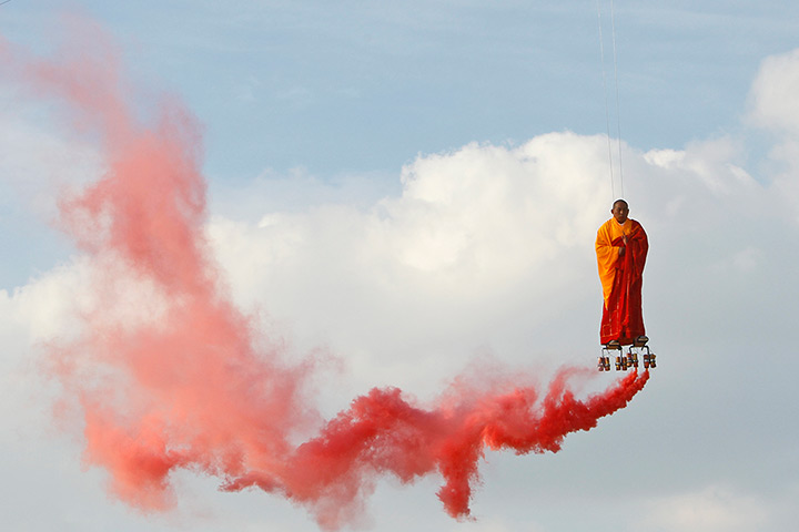 24 hours in pictures: Chinese artist Li Wei performs in the sky at La Villette, Paris
