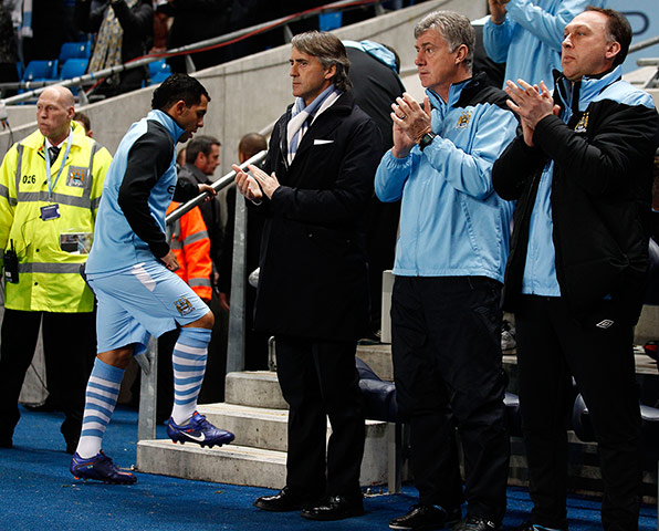 Manchester City v Chelsea: Manchester City's Carlos Tevez takes his place on the substitutes bench 