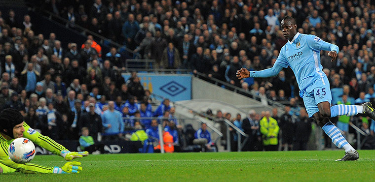 Manchester City v Chelsea: Manchester City's Mario Balotelli shoots against Chelsea