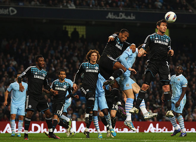 City v Chelsea: Frank Lampard heads the ball clear