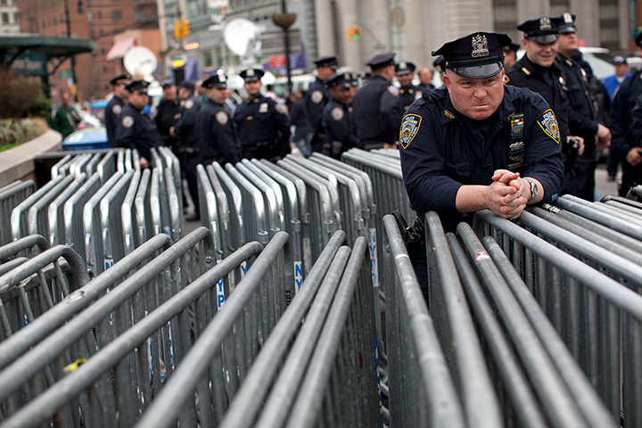 Trayvon Martin march: A police officer waits by barricades as the protest begins