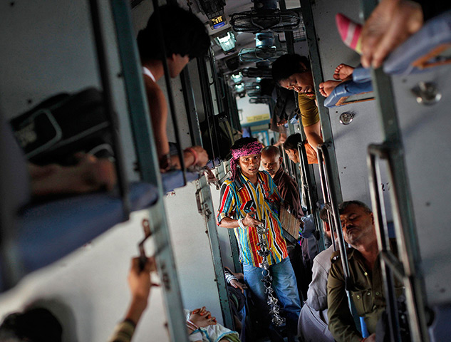 24 hours: India: A man sells locks and chains inside the Kalka Mail passenger train