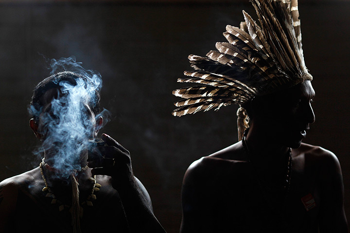 24 hours: IBrasilia, Brazil: An indigenous man smokes during a protest