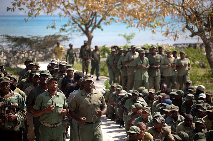 24 hours: Port-au-Prince, Haiti: Members of the dissolved Haitian army parade