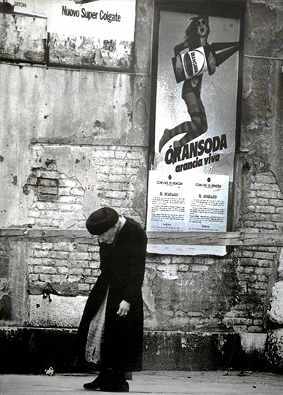 Readers' pictures: Poster on a Venician wall with a passer-by