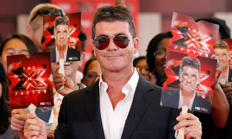 Simon Cowell poses at the world premiere of