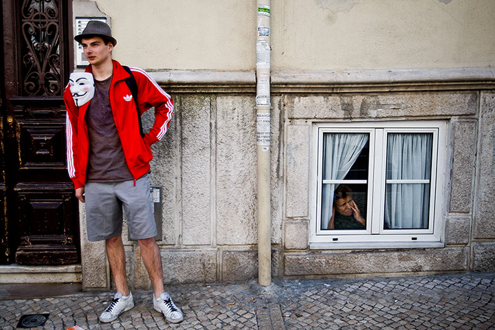 Patricia Melo: A demonstrator with a Guy Fawkes mask 