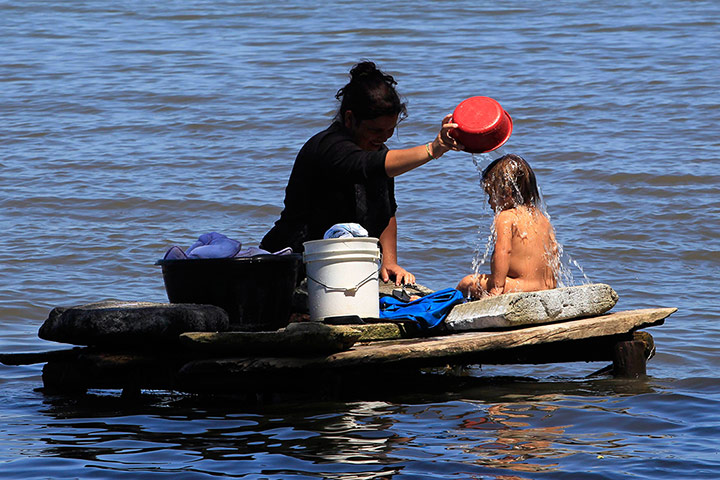 World Water Day: A woman bathes her son at Lake Cocibolca