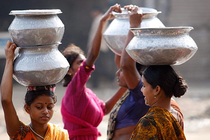 World Water Day: Women carry drinking water 