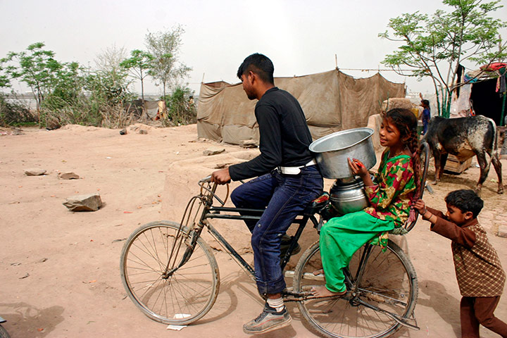 World Water Day: Pakistani carry water in Lahore,