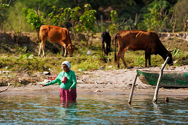 World Water Day: A woman fishes in the ILopango Lake